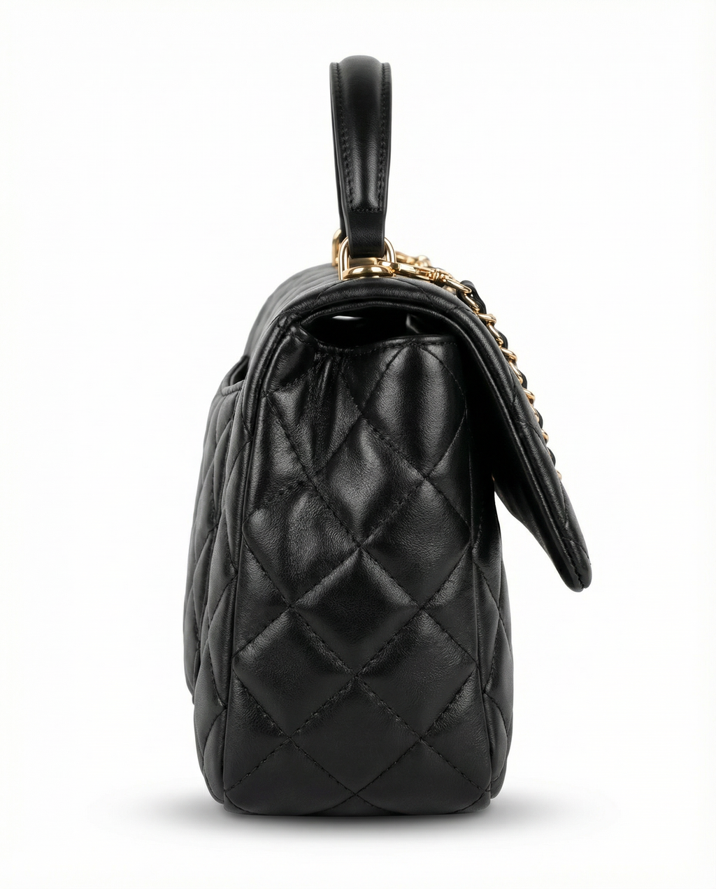 Side profile of black quilted ChristAdorn handbag with structured silhouette and gold hardware.