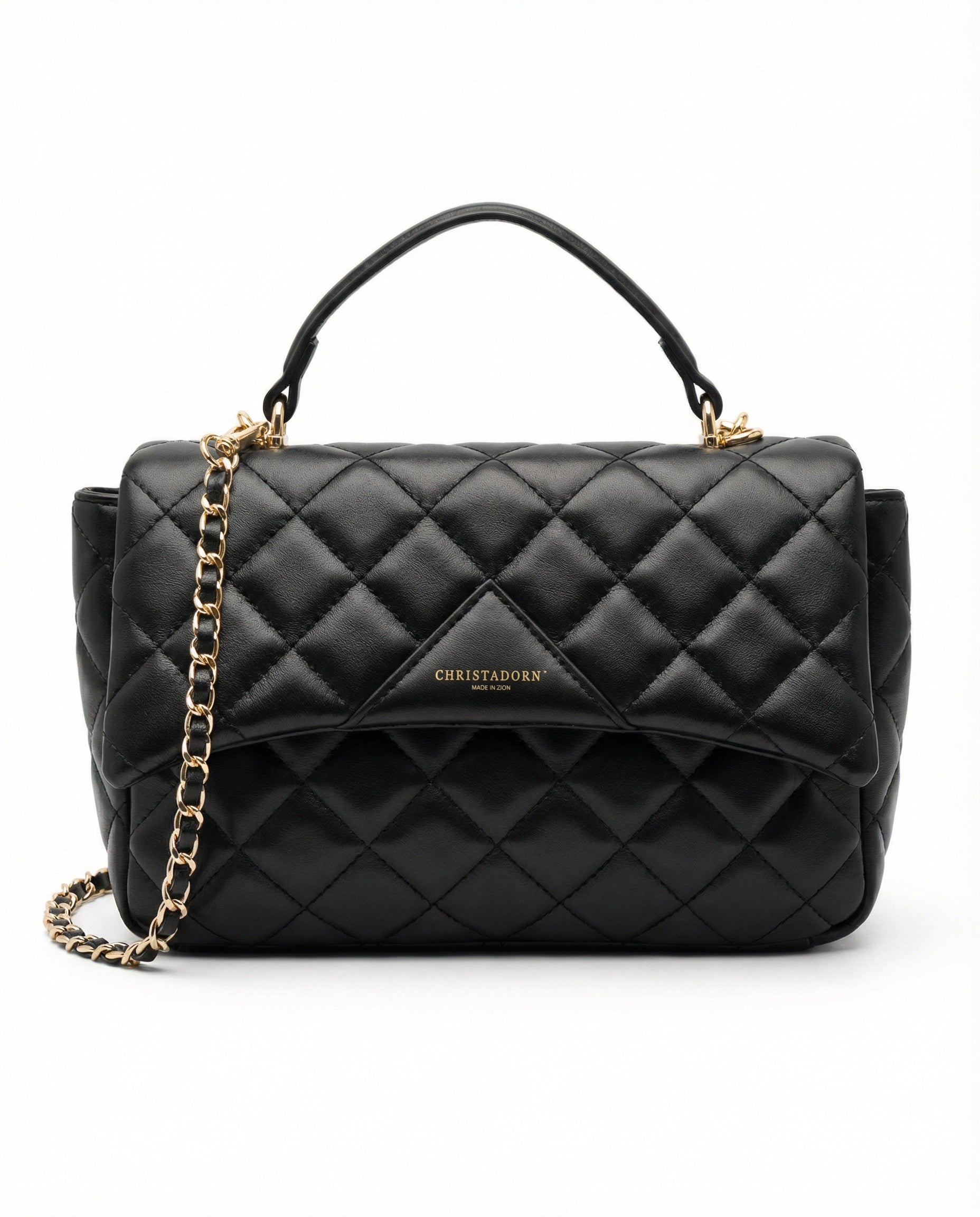 Black quilted ChristAdorn handbag in vegan leather with gold chain strap and top handle on white background.